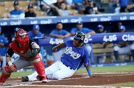 Leones del Escogido toman ventaja en la serie final contra el Licey: ¡La batalla de la capital está reñida!