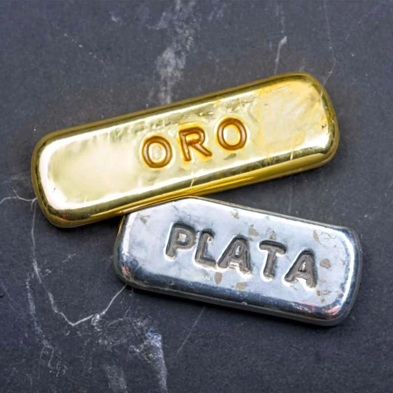 Oro y plata se desploman tras alcanzar récords históricos